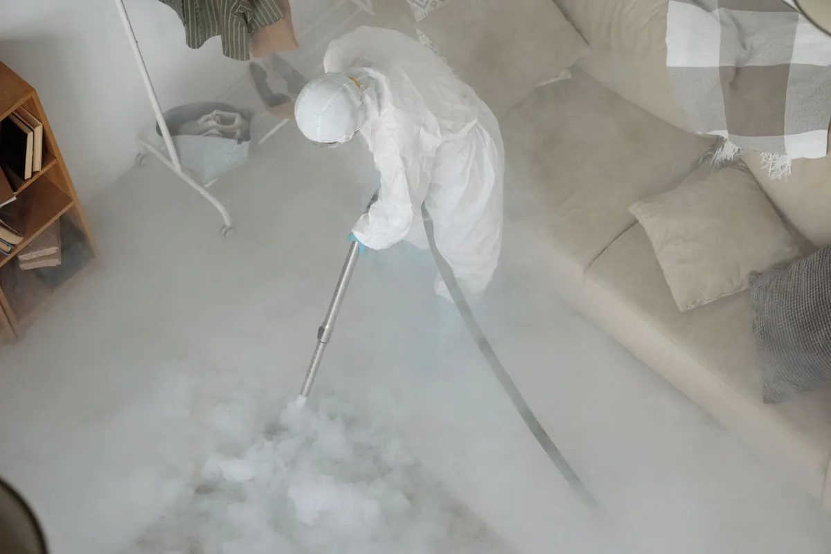 Biohazard cleanup technician in protective equipment, Milton, MA